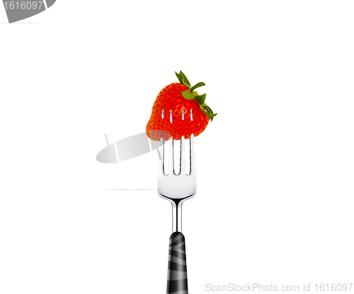 Image of Strawberry pierced by fork,  isolated on white background 