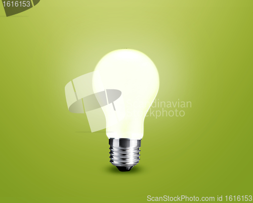 Image of glowing Light bulb idea on green background