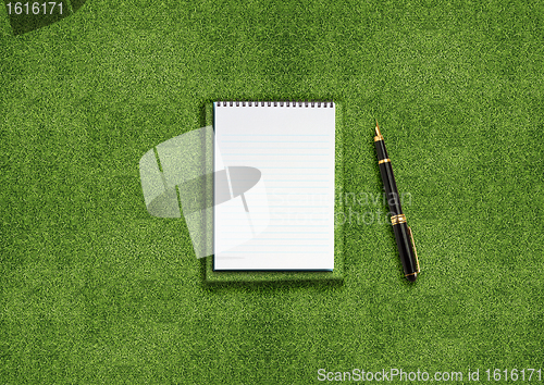 Image of Blank notebook on grass