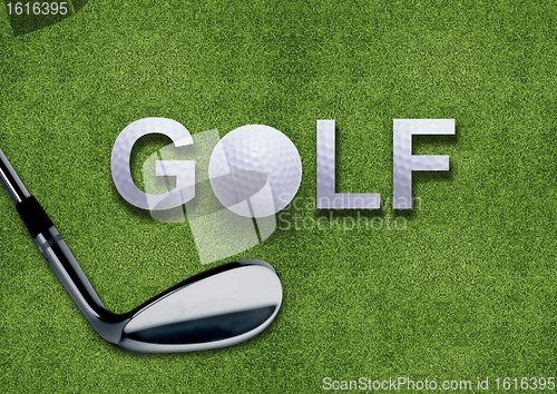 Image of Golf ball and putter on green grass 