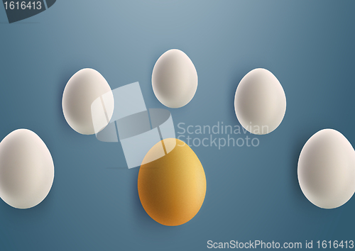 Image of unique golden egg between white eggs