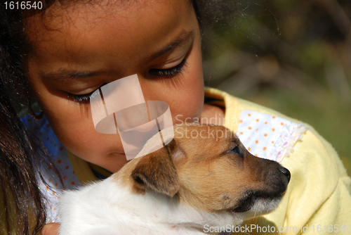 Image of little girl and puppy