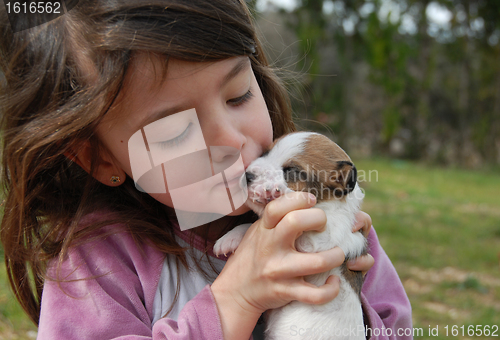 Image of little girl and puppy