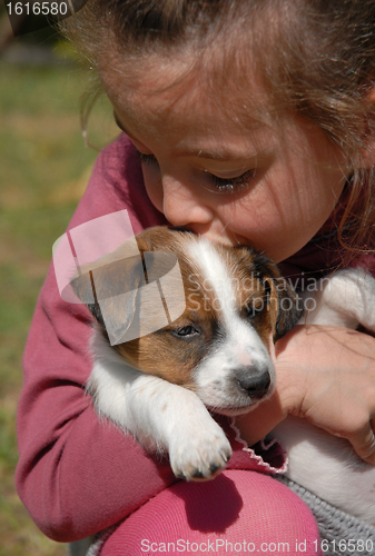 Image of child and puppy