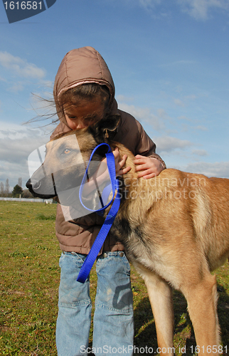 Image of little girl and her dog