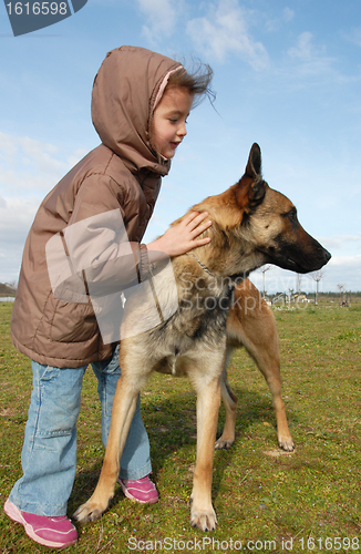 Image of little girl and malinois