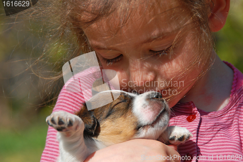 Image of little girl and puppy