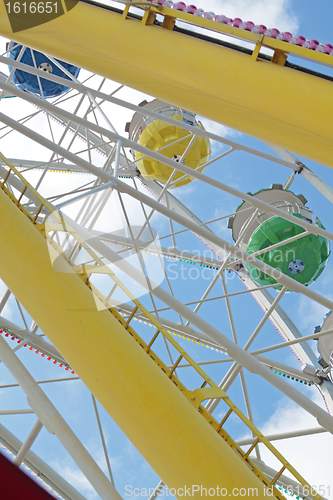 Image of ferris wheel against a blue sky