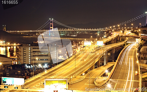 Image of highway and bridge at night