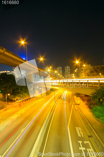 Image of Traffic at night with traces of lights left by the cars on a hig