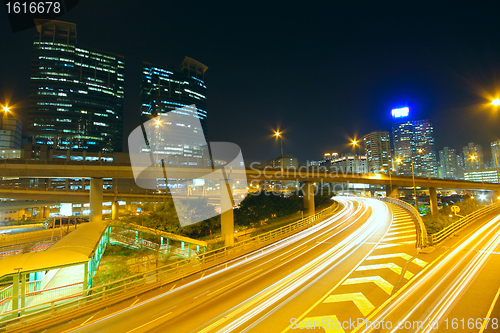 Image of Traffic at night with traces of lights left by the cars on a hig