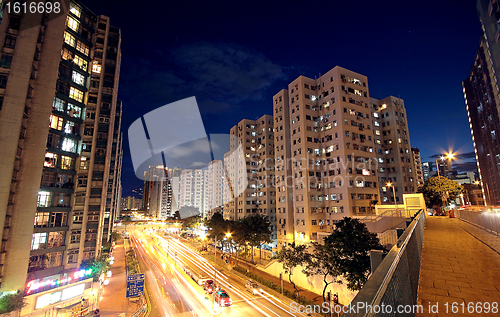 Image of modern urban city at night with freeway traffic