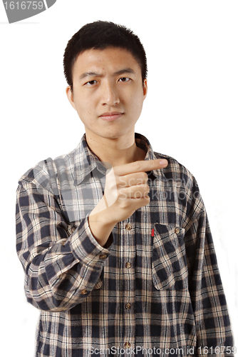 Image of Casual young man pointing left