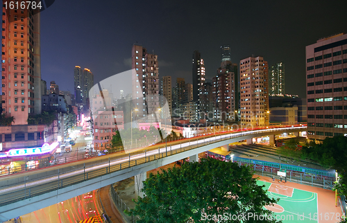 Image of Traffic at night with traces of lights left by the cars on a hig