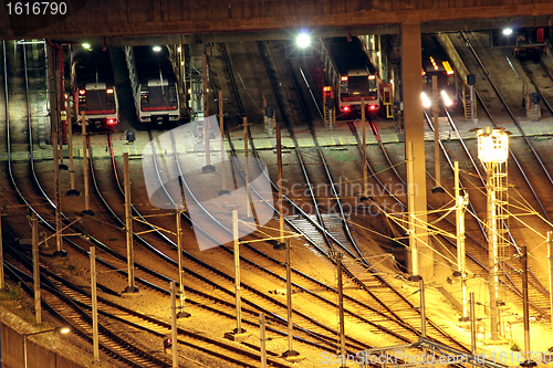 Image of Train tracks in hongkong by night.