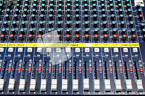 Image of Part of an audio sound mixer with buttons 