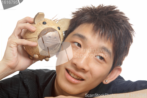 Image of asia man with piggy bank 