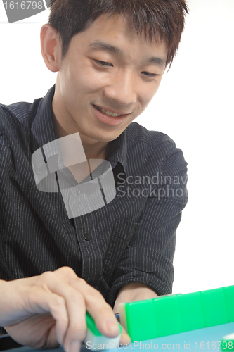 Image of Chinese man play Mahjong, traditional China gamble. 