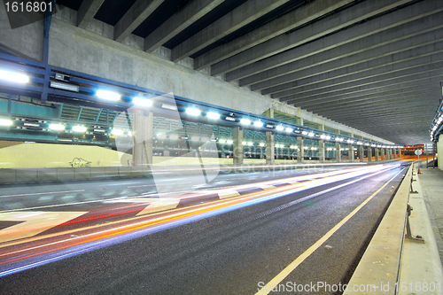 Image of Traffic at night with traces of lights left by the cars on a hig