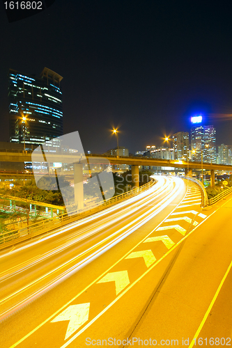 Image of Traffic at night with traces of lights left by the cars on a hig