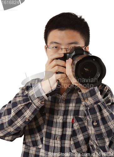 Image of Male photographer holding camera