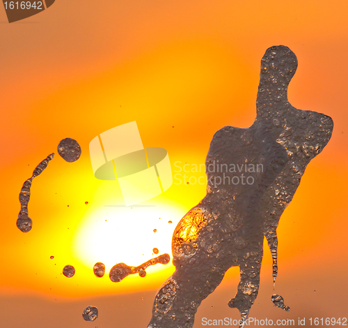 Image of A fountain in the sunset