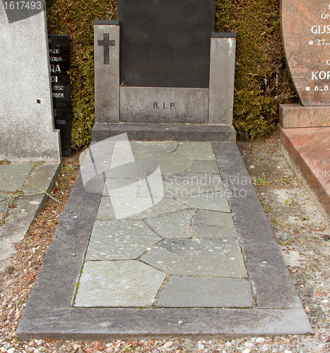 Image of Holy Cross on an old marble grave