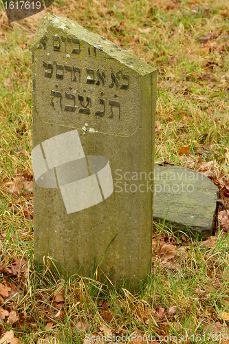 Image of A broken gravestone