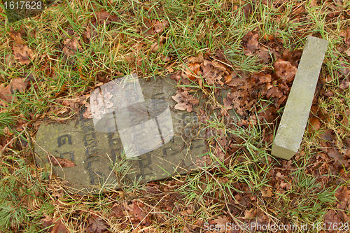 Image of A broken gravestone