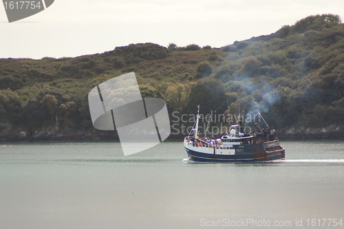 Image of A fishingboat is leaving port