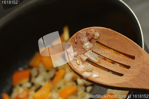 Image of cooking with a spoon