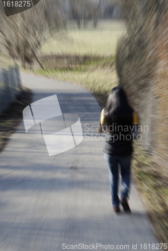 Image of walking woman