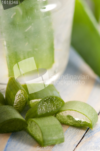 Image of aloe vera juice with fresh leaves