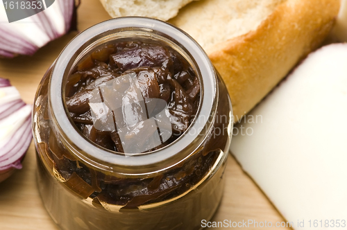 Image of Onion jam in jar, goat's cheese and fresh bread