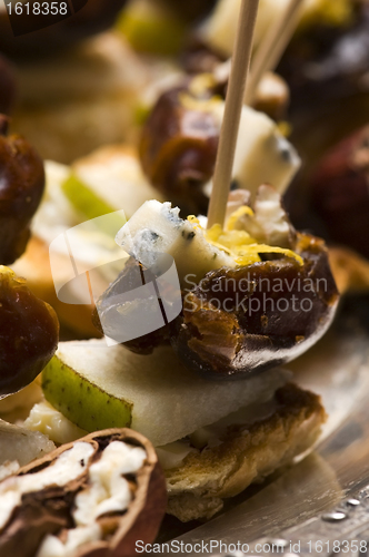 Image of Appetizer Plate with Dactyl, Pecan nuts and Cheese