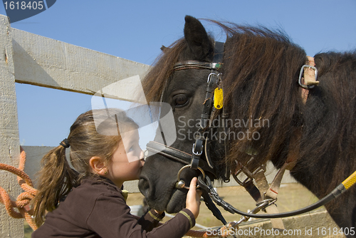 Image of little girl and pony