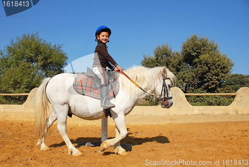 Image of child and pony