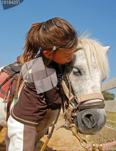 Image of child and pony