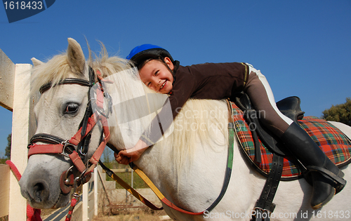 Image of little girl and shetland pony