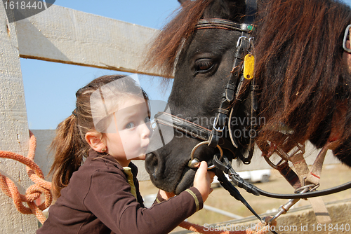 Image of little girl and her pony