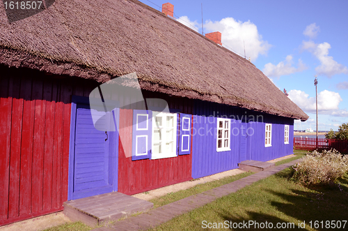 Image of House with straw roof.