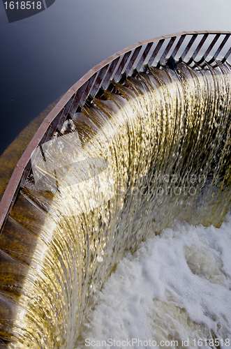 Image of Water runs through dam.