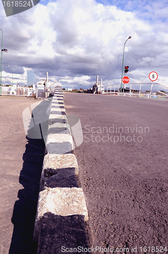 Image of Striped border, traffic light, stop sign.