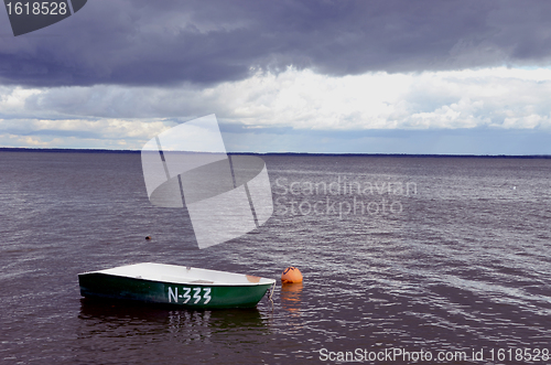 Image of Lonely plastic boat.