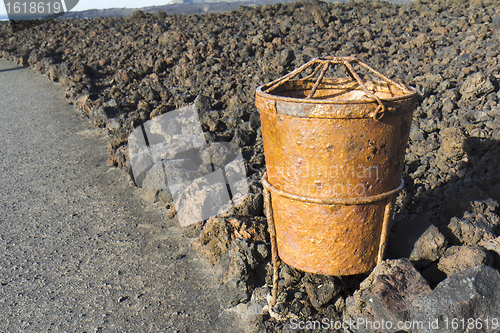 Image of Rusty trash can