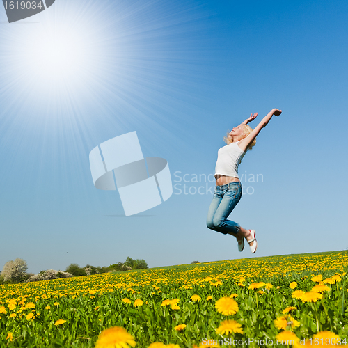 Image of happy young woman on meadow