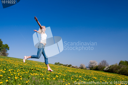 Image of happy young woman on meadow