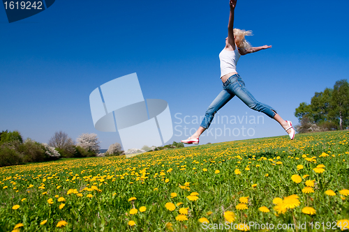 Image of happy young woman on meadow