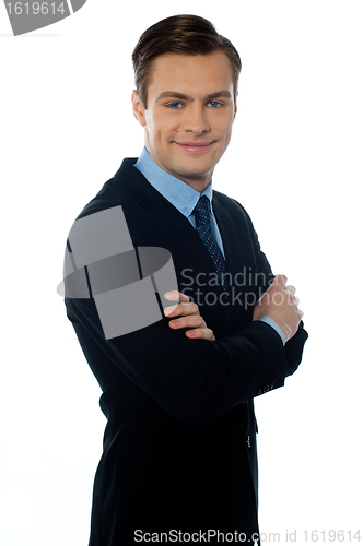 Image of Charming young businessman posing in style