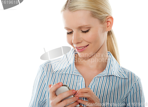 Image of Portrait of a glamourous bussinesswoman texting